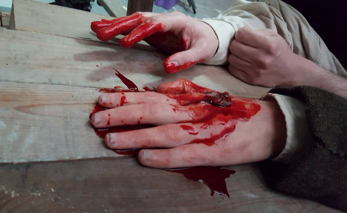 the lodgers silicone hand stabbed